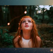 awe-and-wonder-education-SBL.jpg Child smiling in awe while looking at glowing lights in the forest