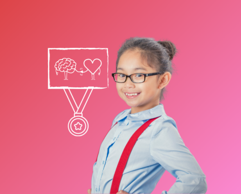 A young girl with glasses smiling when learning strategies for Positive School Experiences